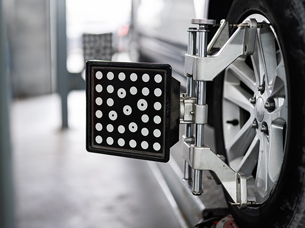 Wheel alignment target attached to a wheel