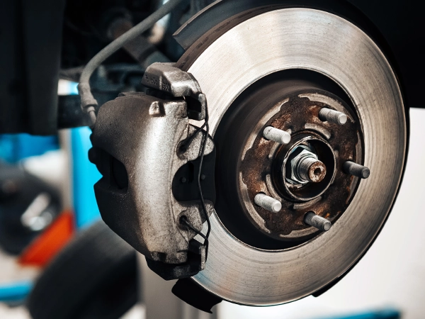 brake rotor and caliper on a car with the wheel removed