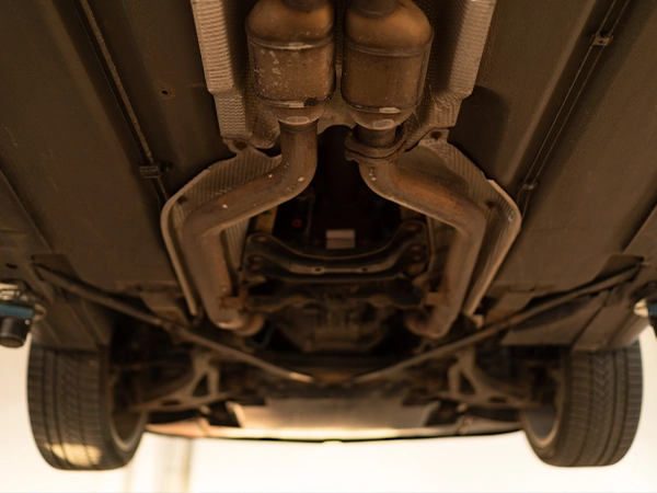 underside of a car showing catalytic convers